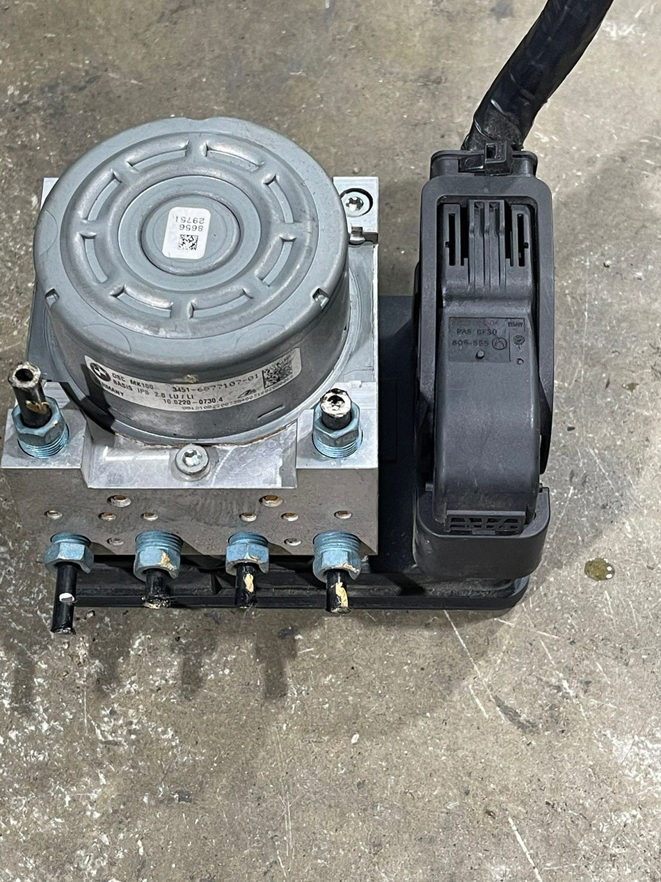 BMW / MINI Cooper Group DSC (Dynamic Stability Control) hydraulic pump modulator and electronic ECU controller assembly
